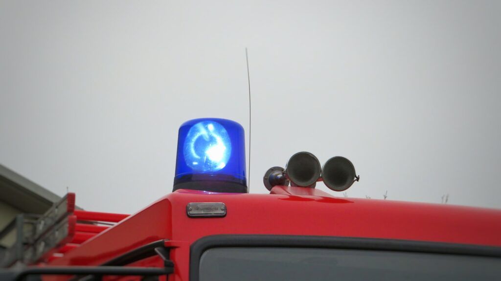 red car with blue and black headphones